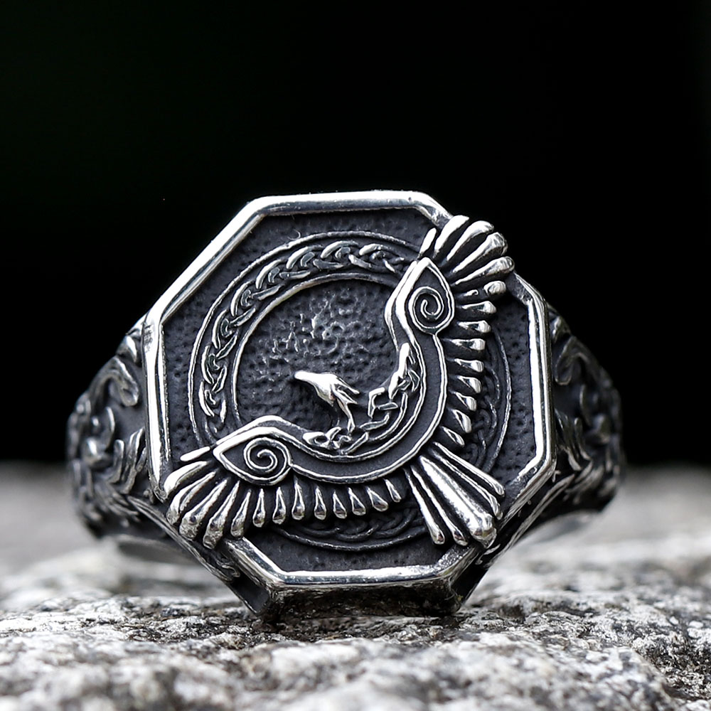 Close-up detail of the raised silver flying eagle design on the octagonal face of the Viking ring.