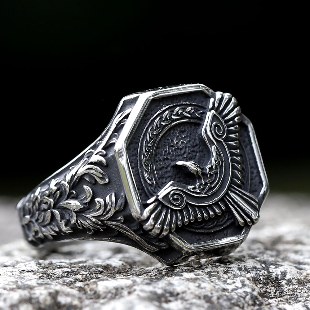 Angled view of the stainless steel Norse ring, highlighting the intricate knotwork on its band.