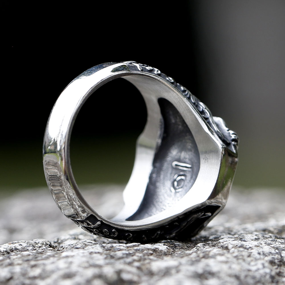 Frontal view of the Norse mythology ring, with the eagle motif centered and clear against a dark background.