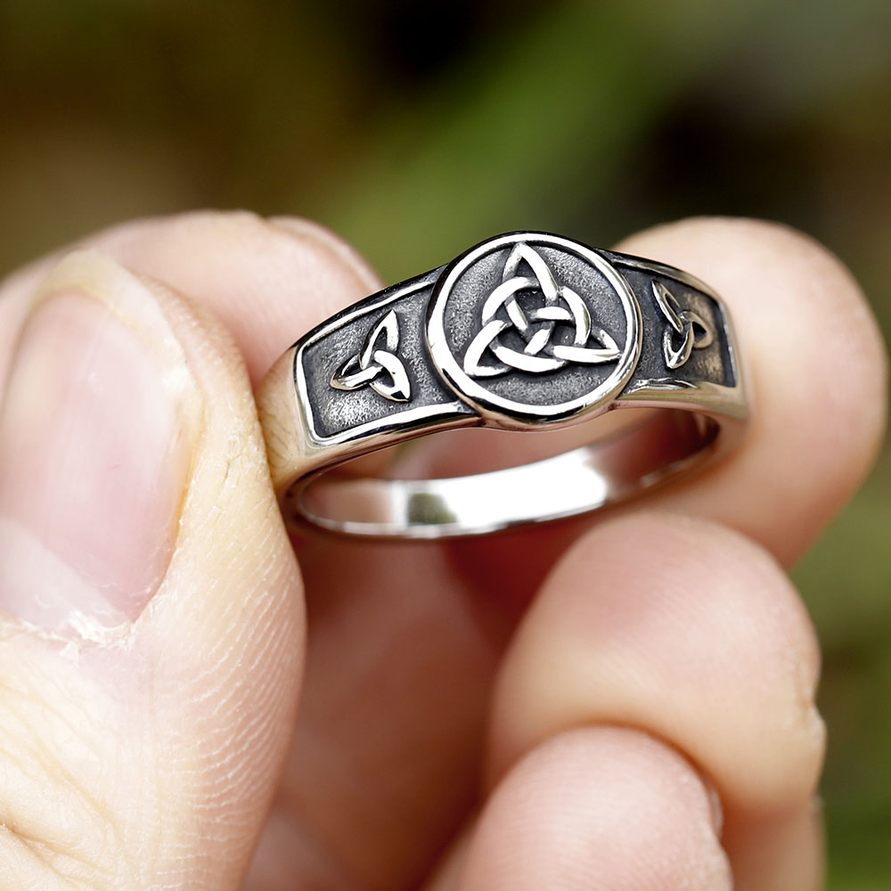 Angled shot of the heavy-duty stainless steel ring, showcasing its polished edges and symbolic details.