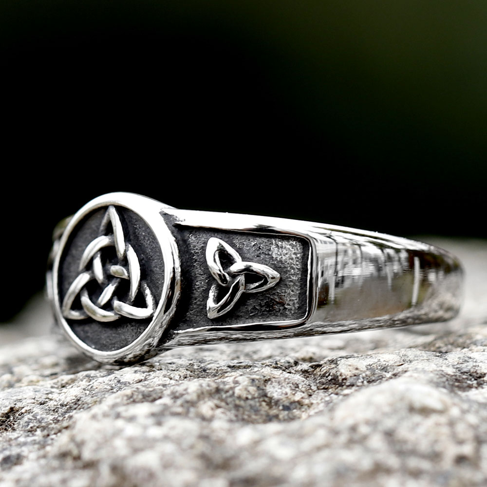 Stainless steel Celtic knot ring worn on a finger, demonstrating its comfortable fit and distinctive style.
