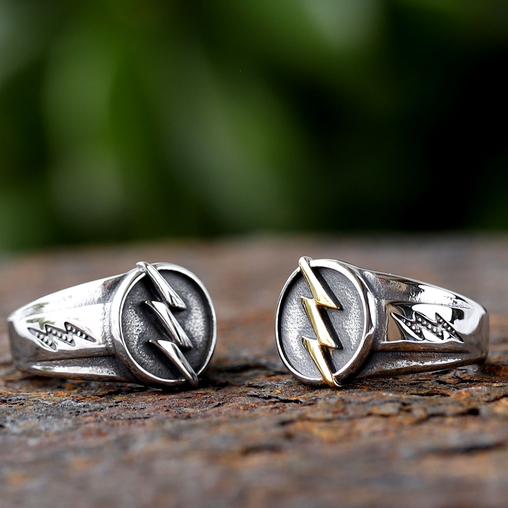 Side profile of stainless steel ring showing etched lightning bolt pattern on the band
