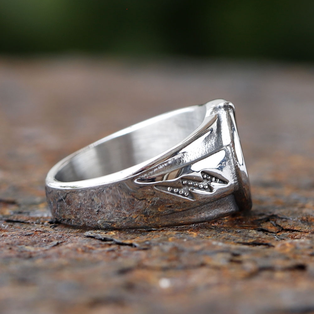 Men's stainless steel lightning bolt ring worn on a finger