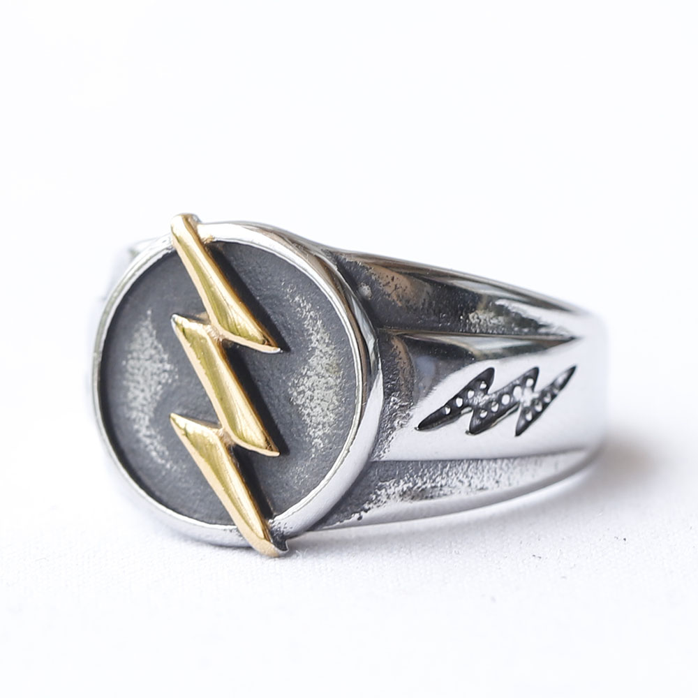 Men's 316L Stainless Steel ring with gold-plated lightning bolt on oxidized face