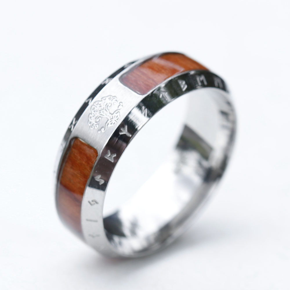 Side perspective capturing both the Tree of Life and runic carvings on the unique ring.