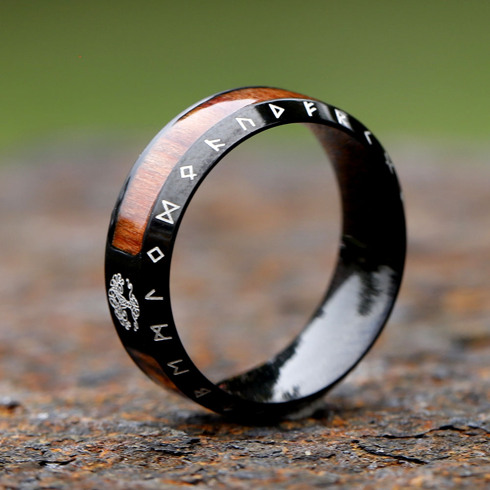 Detailed view highlighting the rich brown wood inlay sections on the men's ring.