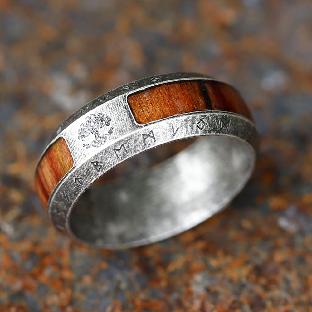 Close-up of the distressed, antique-look stainless steel finish surrounding the inlay.