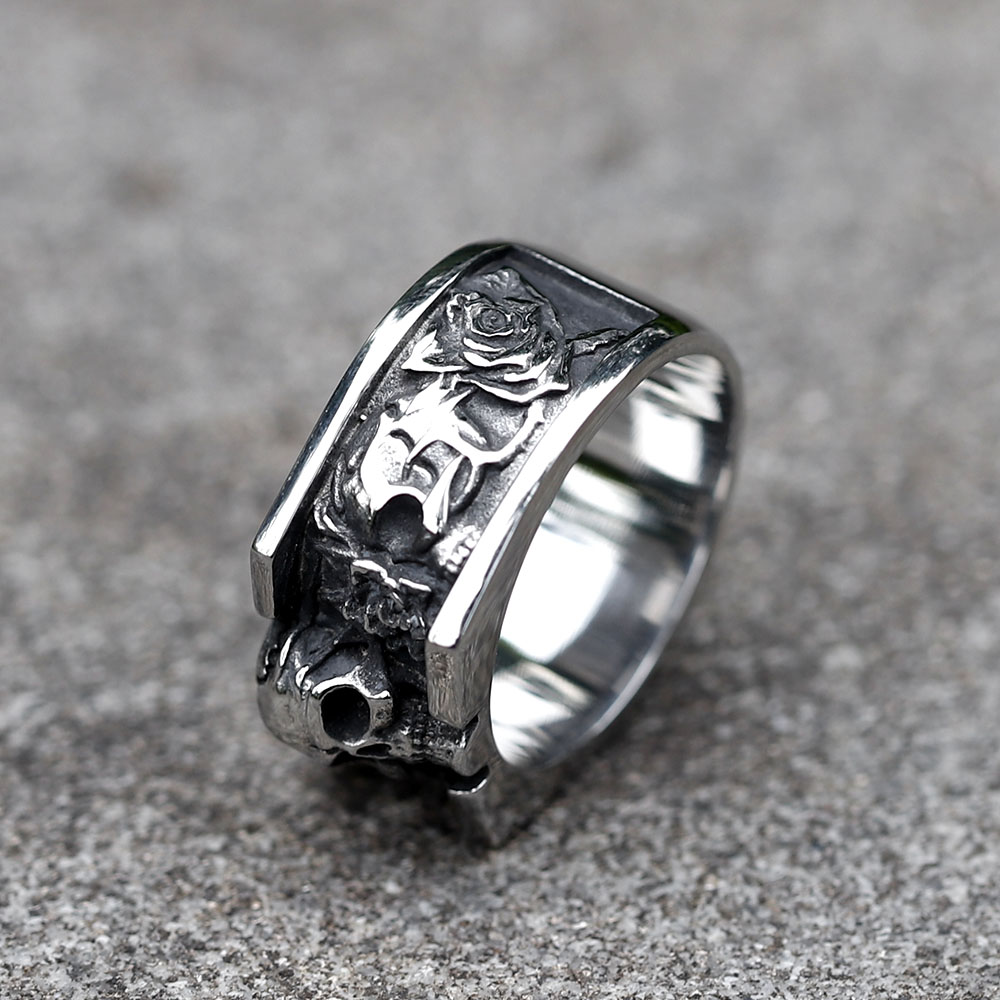 Close-up of the vintage skull design on the men's stainless steel ring, highlighting the detailed forehead and upper jaw from a top-right angle.