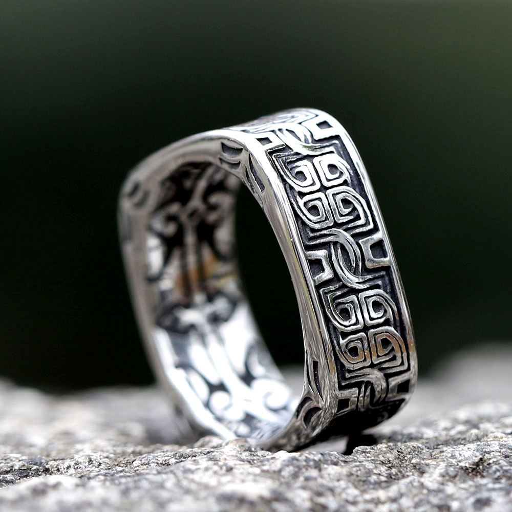 Detail view of the upper band of the square ring, highlighting the embossed Celtic knot design.