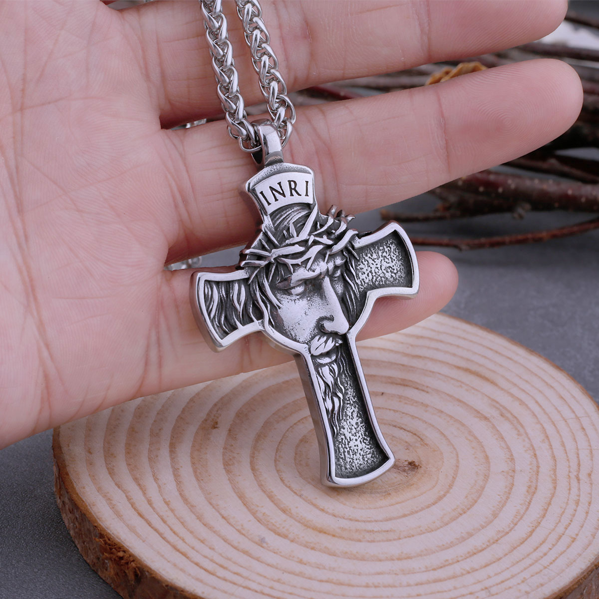Textured finish on the arms of the 316L stainless steel Jesus cross pendant, viewed from the side.