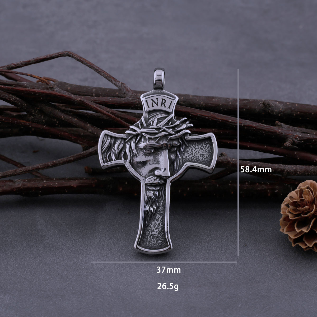 Angled view of the stainless steel Jesus cross pendant, emphasizing the 'INRI' inscription and rustic detail.