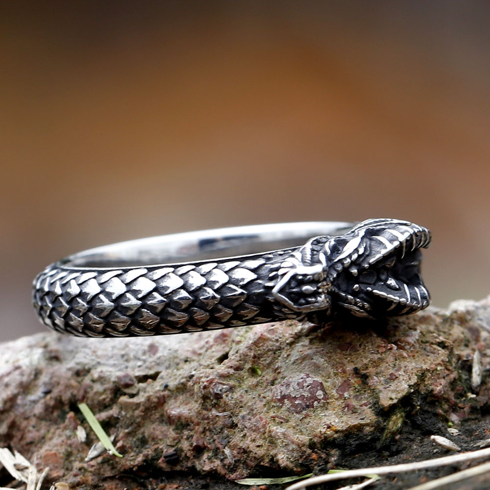 Close-up of the intricately carved dragon head on the stainless steel ring.