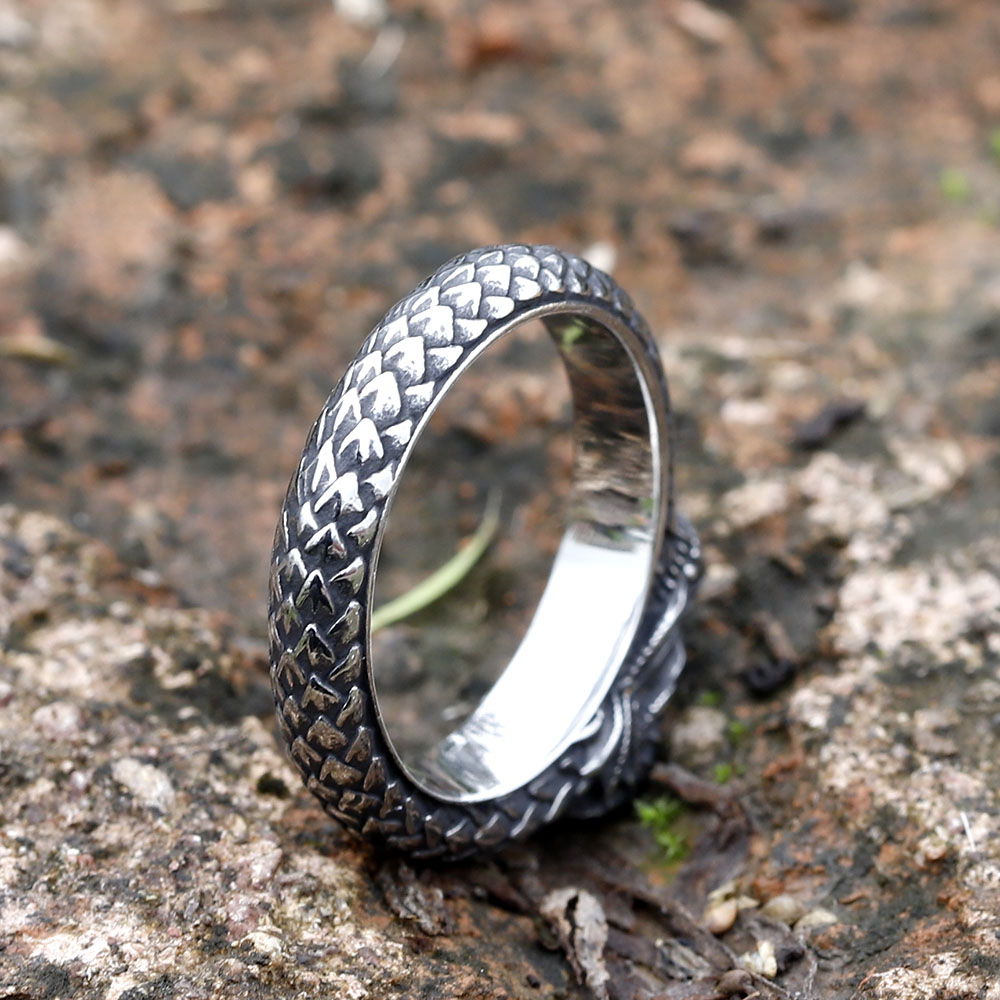 Mid-section view of the 316L stainless steel dragon ring's textured scales.