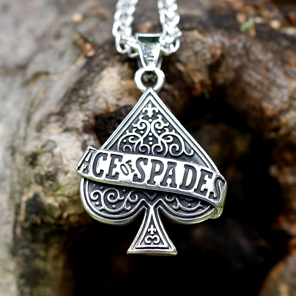 Detailed view of 'ACE OF SPADES' engraved on the gothic-style pendant