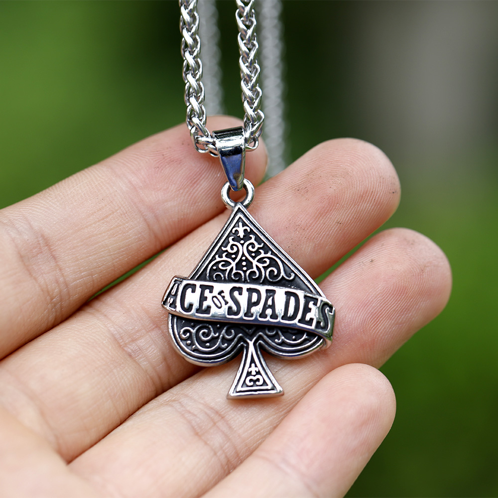Robust 60cm stainless steel chain and Ace of Spades necklace on dark rock