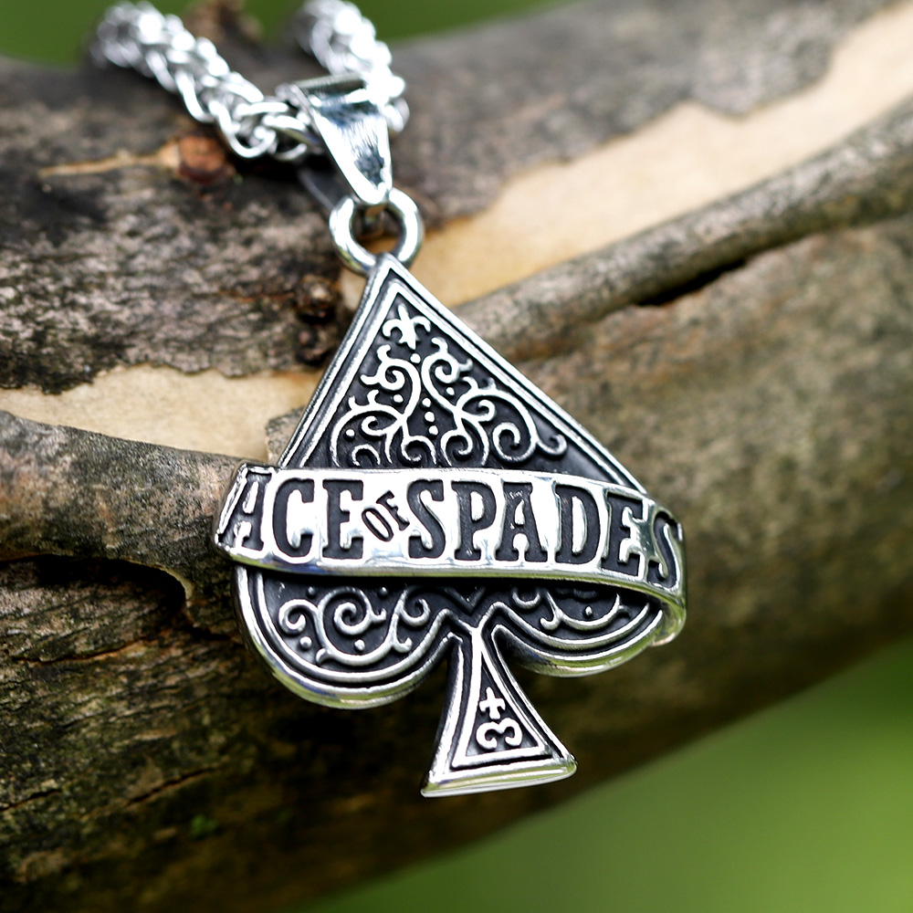 Men's 316L stainless steel Ace of Spades pendant with chain on natural texture