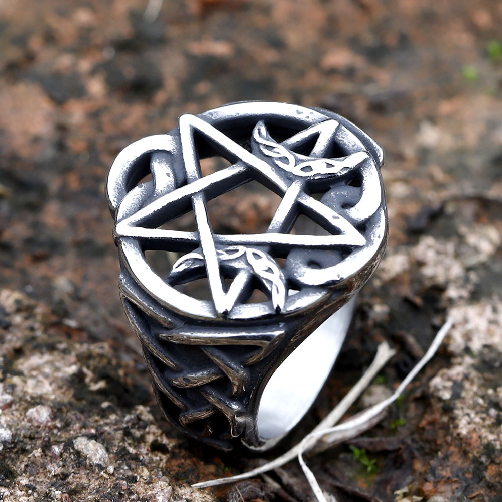 Detailed shot showcasing the five-pointed star (pentagram) at the center of the ring.