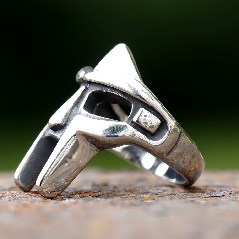 Side profile of the MF Doom mask ring, highlighting its intricate details and robust design.