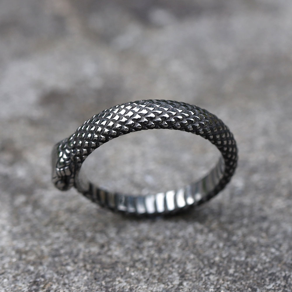 Textured scales visible on the body of the stainless steel snake ring.