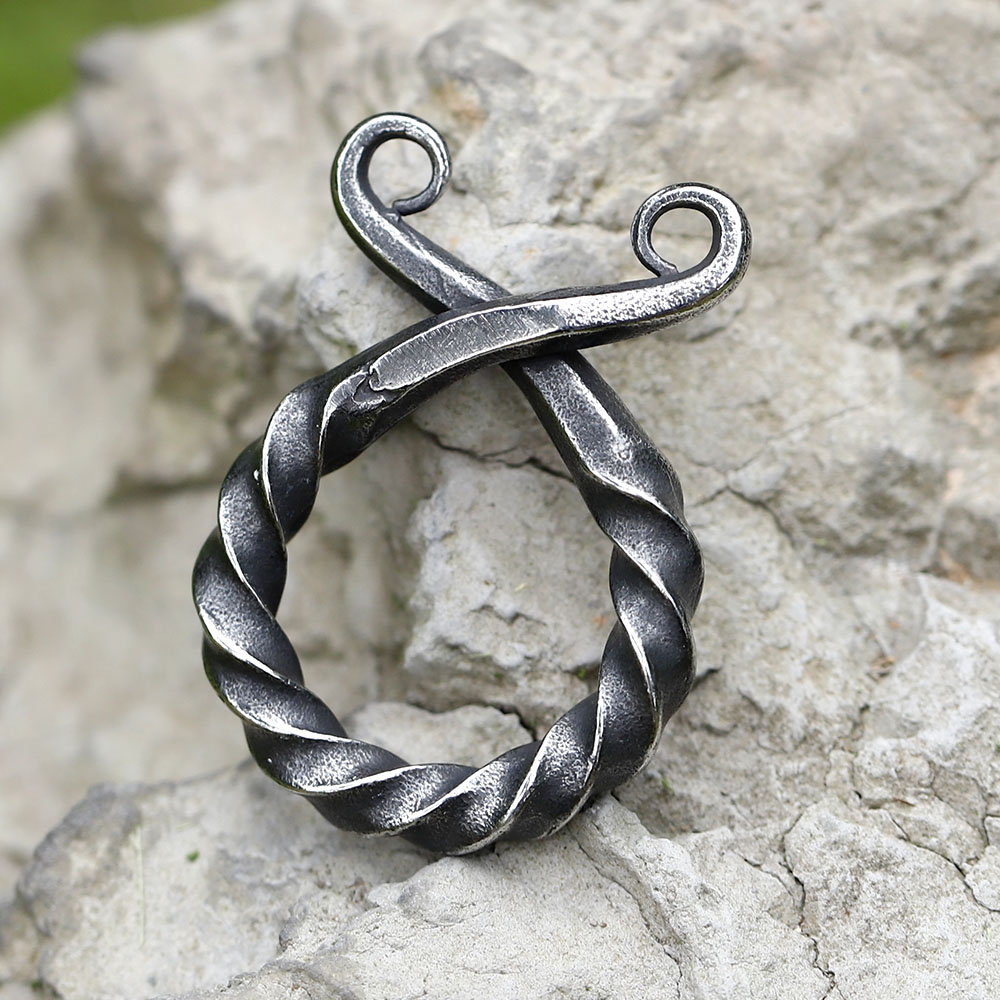Rustic finish and twisted form of the men's stainless steel amulet pendant