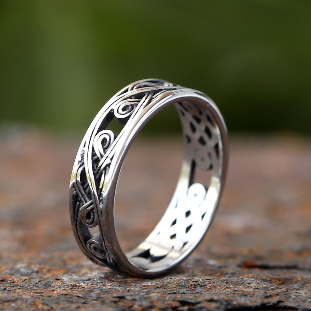 Close-up of the intricate interwoven Celtic knot design on the upper part of the ring
