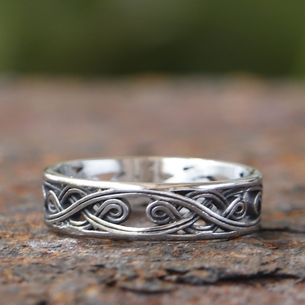 Underside view emphasizing the intricate cut-out details of the openwork ring