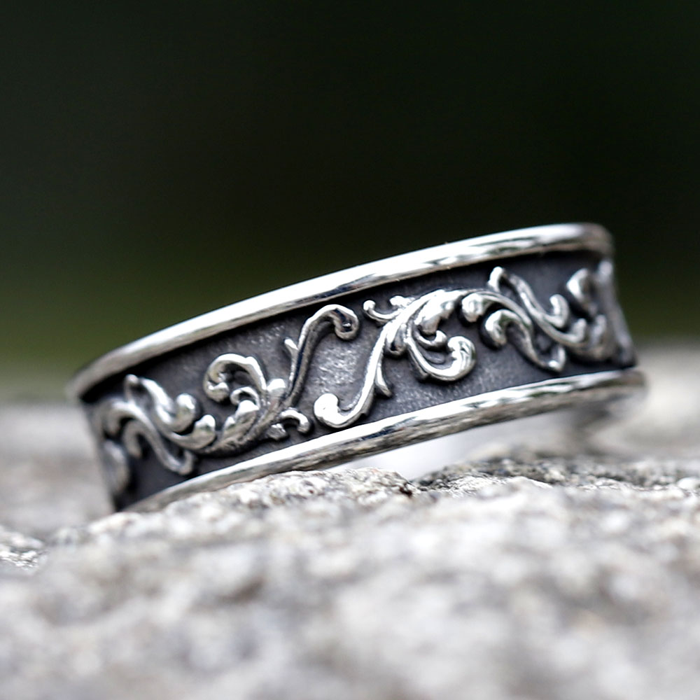 Side angle of the stainless steel ring, showing the raised texture of the Viking-inspired design.