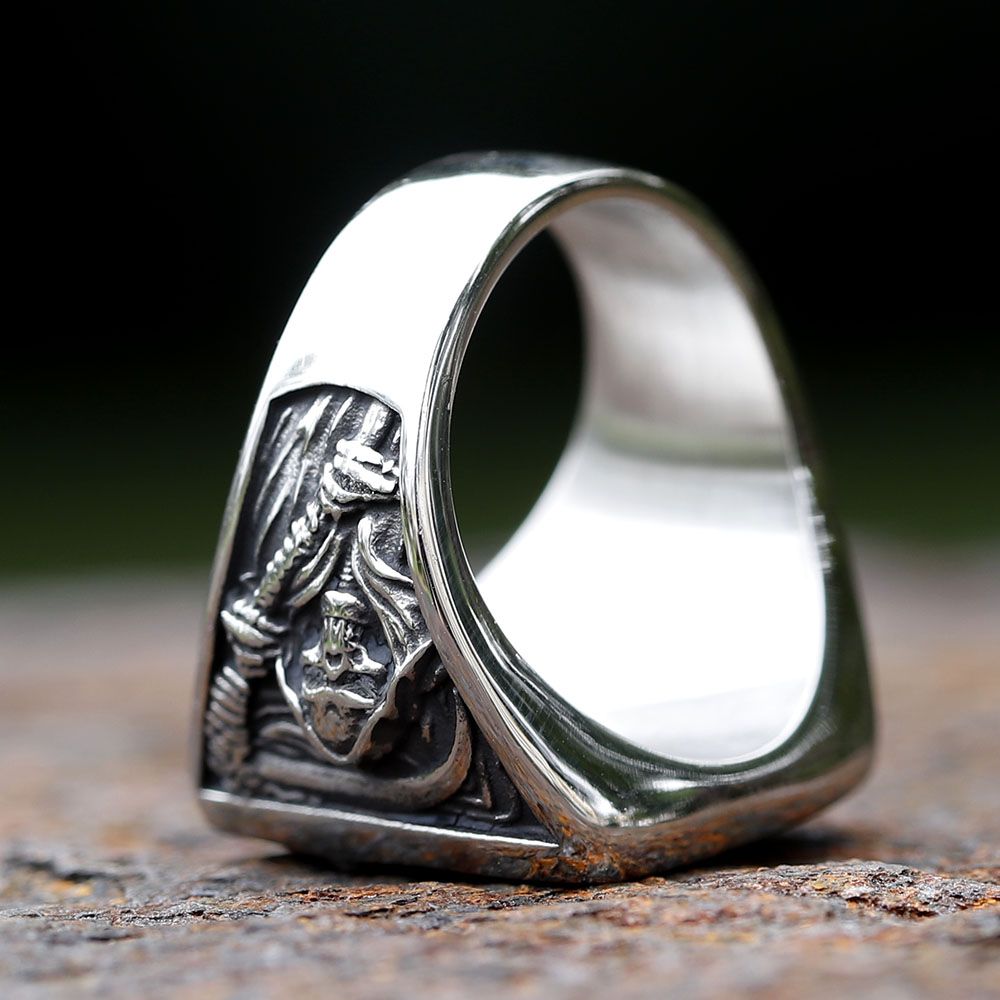 Side detail of the thick band and death sickle blade on the vintage stainless steel skull ring.