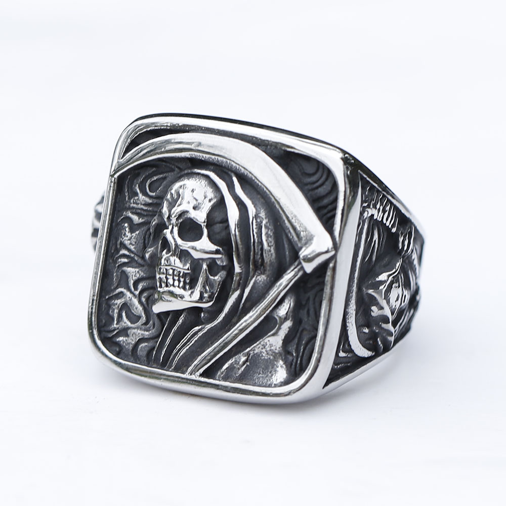 Detailed view of the hooded skull's face on the vintage stainless steel ring.