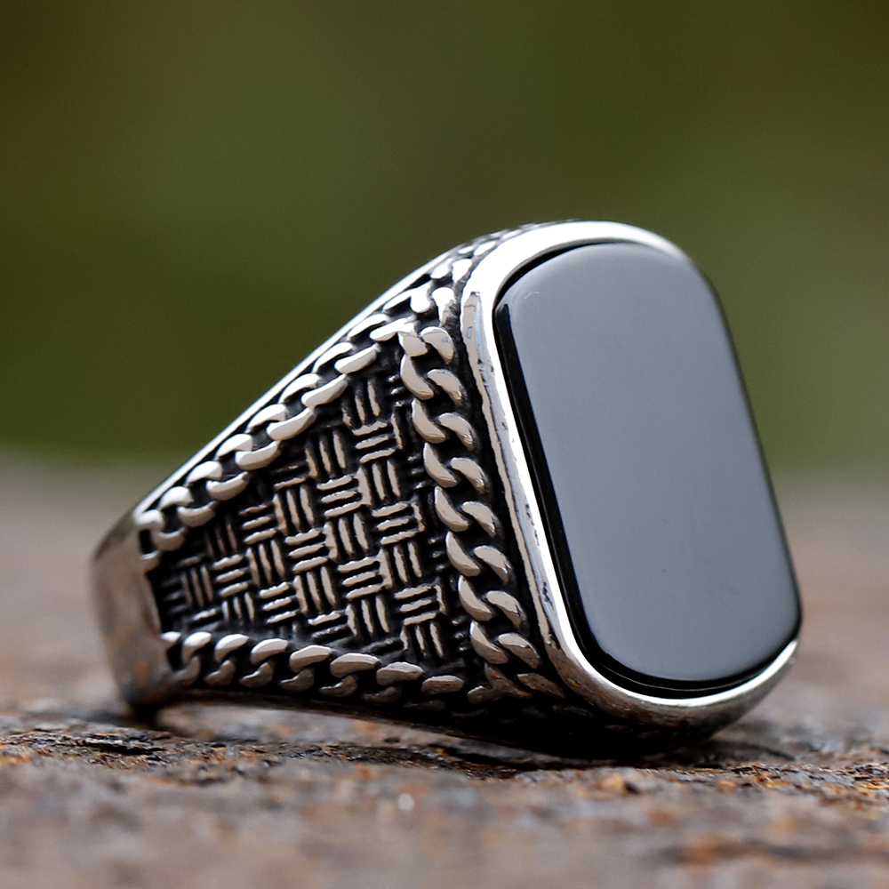 Side view of the stainless steel men's ring, highlighting the textured band design.