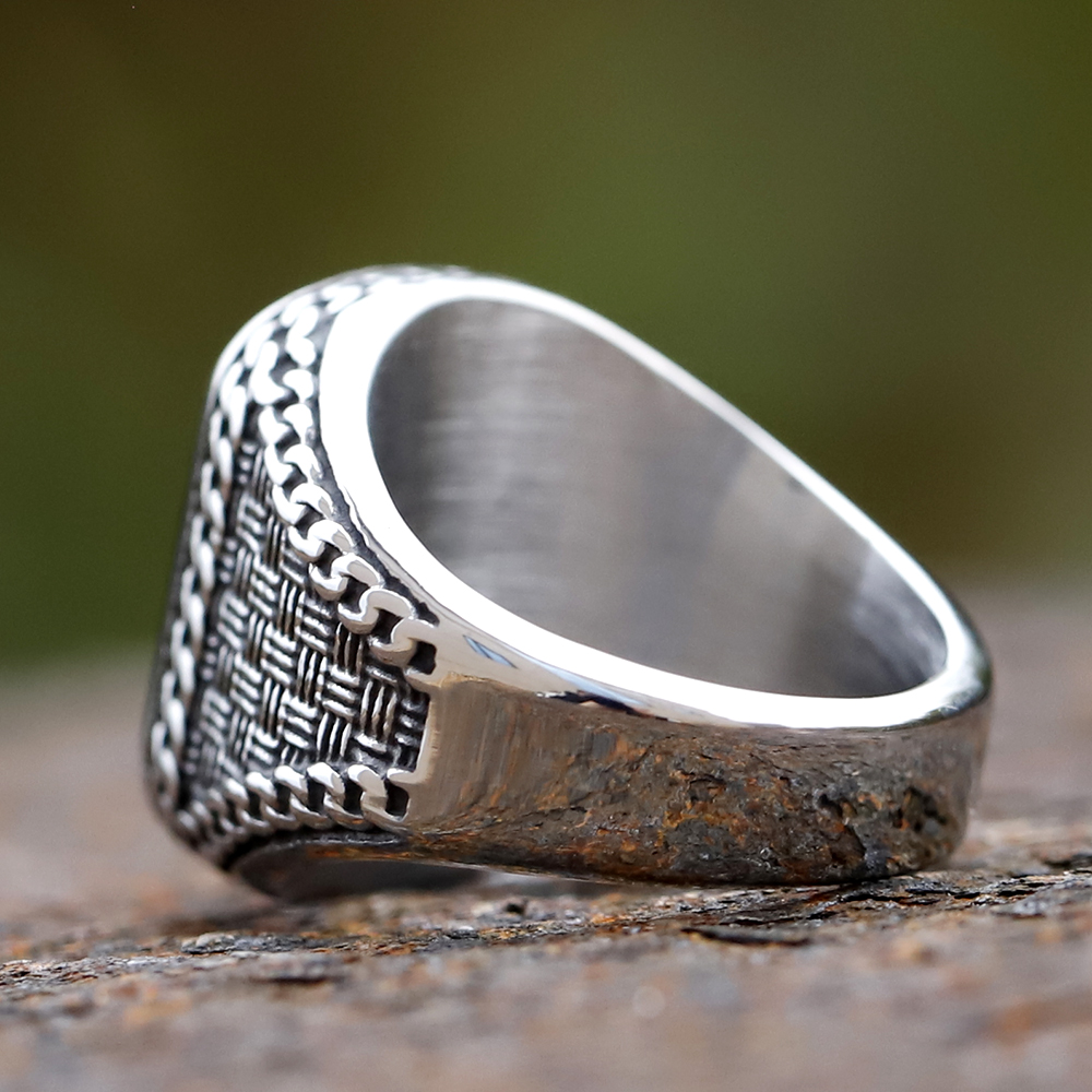 Stainless steel ring for men showcasing the smooth, rectangular black onyx-like stone.