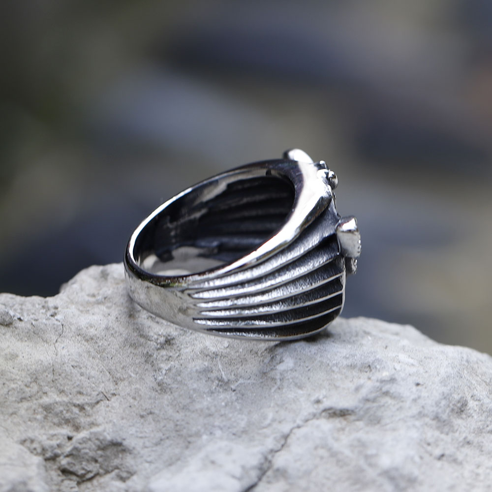 Side profile of the punk-style 316L stainless steel ring with skull moth emblem.