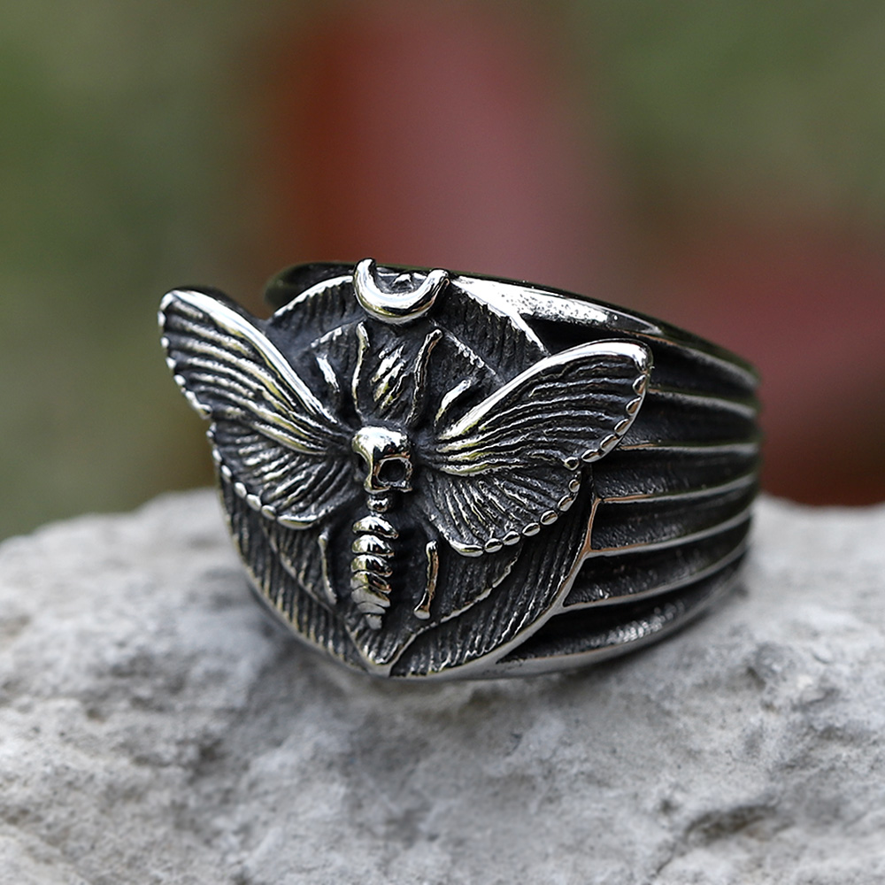Close-up of the intricate Death's Head Moth design on a men's stainless steel ring.