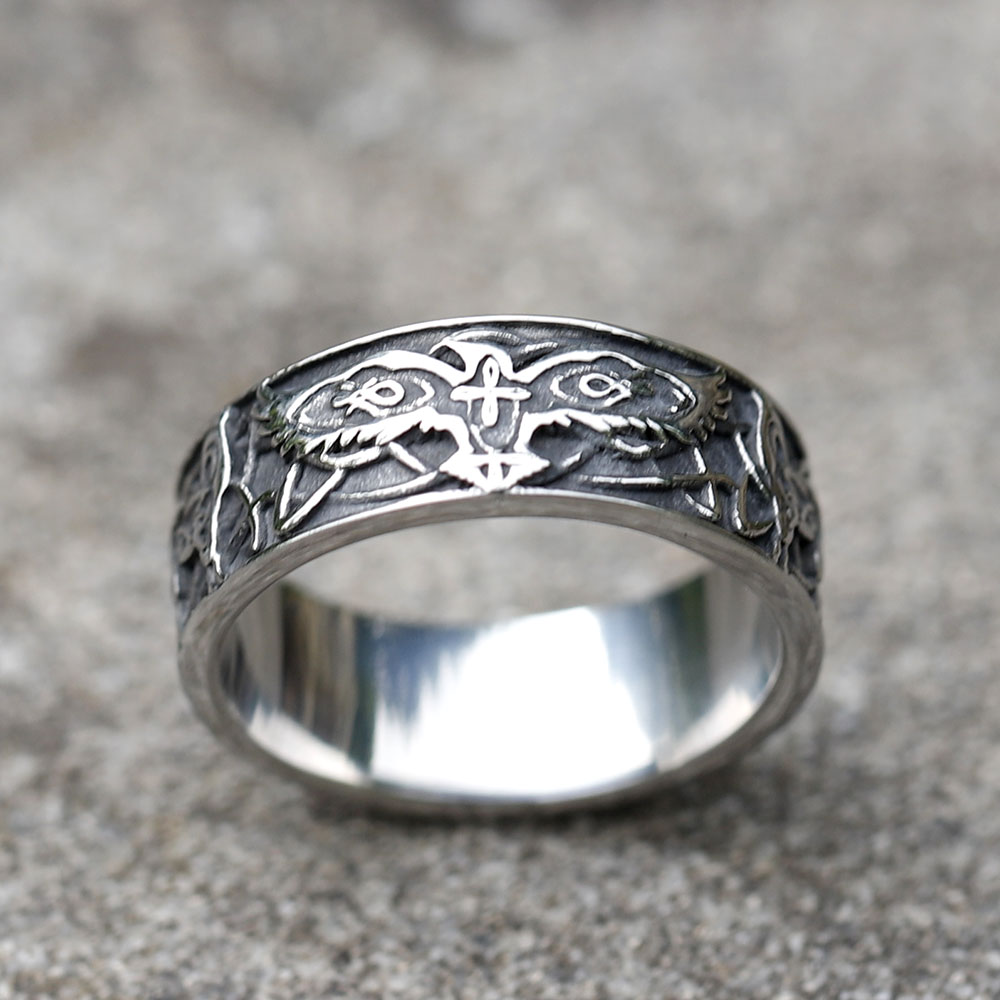 The vintage Viking eagle amulet ring shown on a man's finger, showcasing its fit and appearance