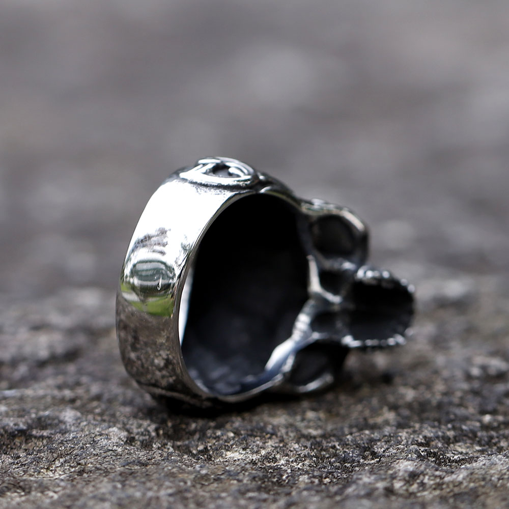Side view of the skull ring, emphasizing the lower jaw and the textural quality of the 316L stainless steel.