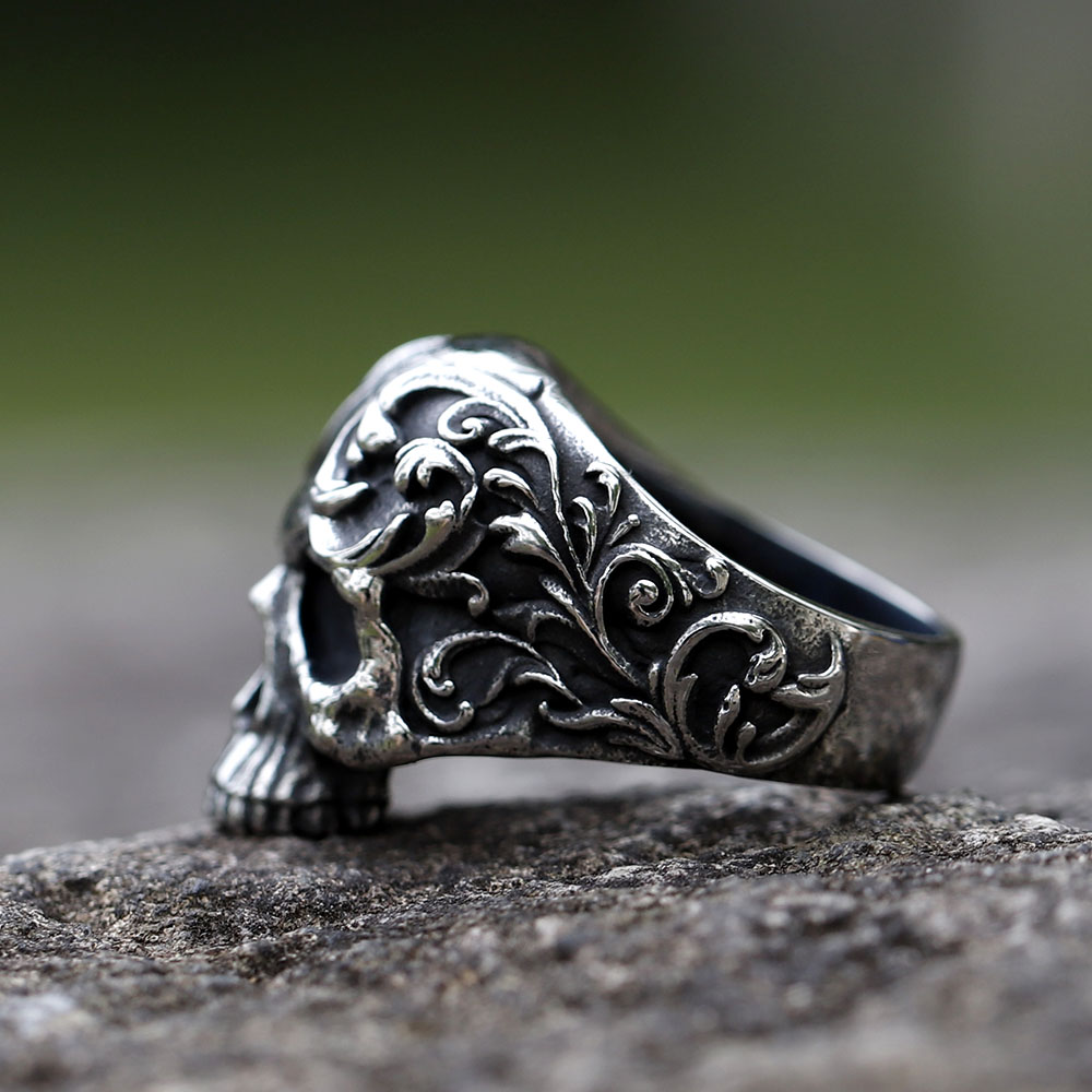 Frontal close-up of the detailed skull face, nose, and teeth on the stainless steel gothic punk ring.
