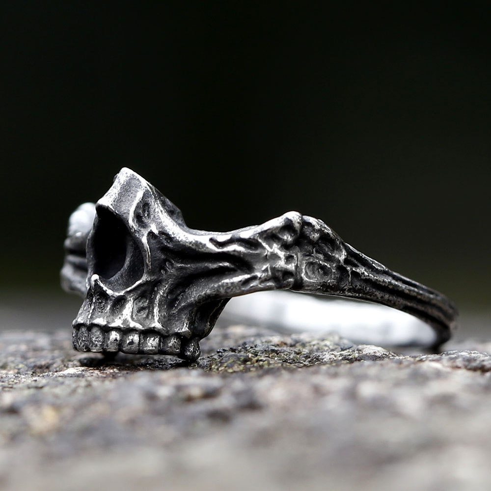 Side angle of the punk rock skull ring, highlighting the textured band.