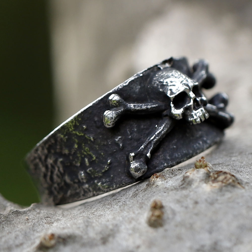 Side view of the distressed 316L stainless steel ring, highlighting the textured band and bone details.