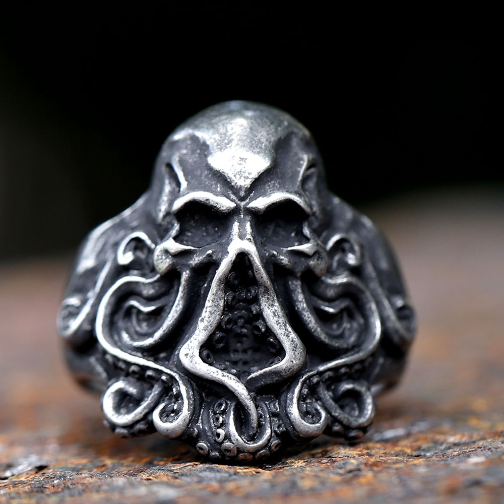 Detailed close-up of the skull head with empty eye sockets on the octopus ring.