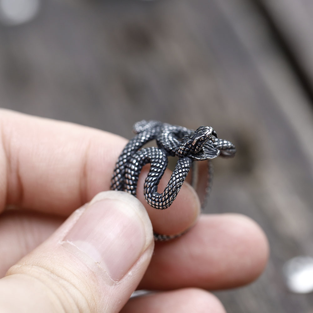 Detailed close-up of the snake's textured body on the 316L stainless steel ring, showing individual scale patterns.