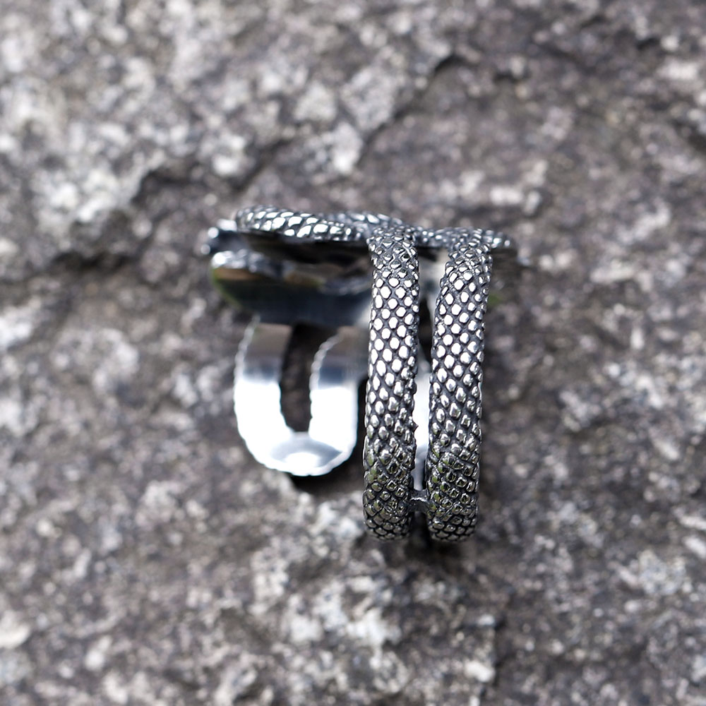 Close-up view of the coiled body of the 316L stainless steel snake ring, highlighting textured scales.