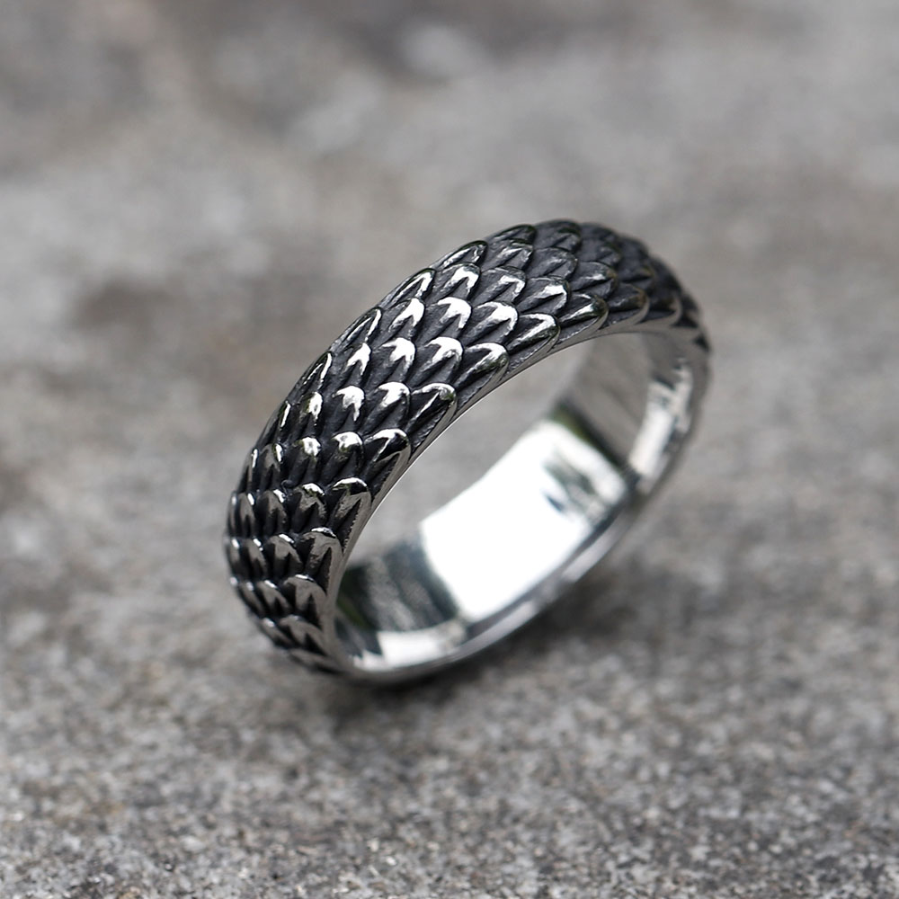 Close-up of the textured dragon scale design on the men's stainless steel ring.