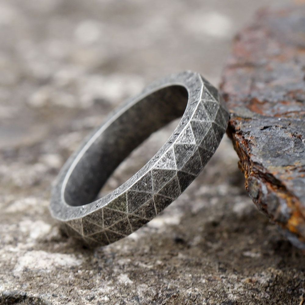 Rustic and powerful, this stainless steel rune ring captures ancient Viking aesthetics.