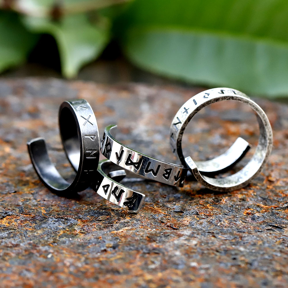 Detailed shot of the men's Viking rune ring, highlighting the oxidized finish and runic script.