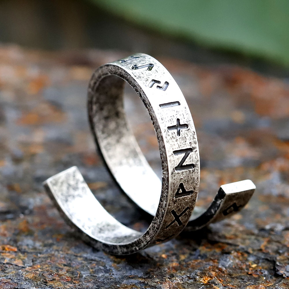 Top-down perspective of the retro rune ring on a dark background, showcasing its full design.