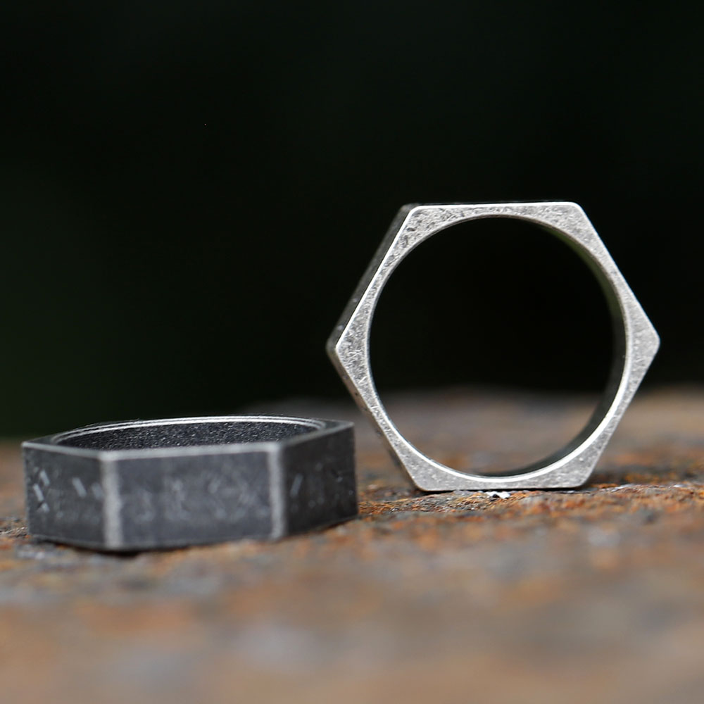 Detail shot of the lower facets of the hexagon ring, emphasizing the unique shape and runic symbols.
