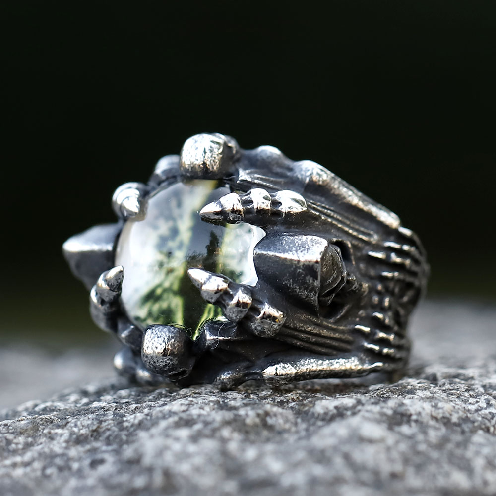 Top-down perspective of the 316L stainless steel skull ring, highlighting the red stone and intricate design.