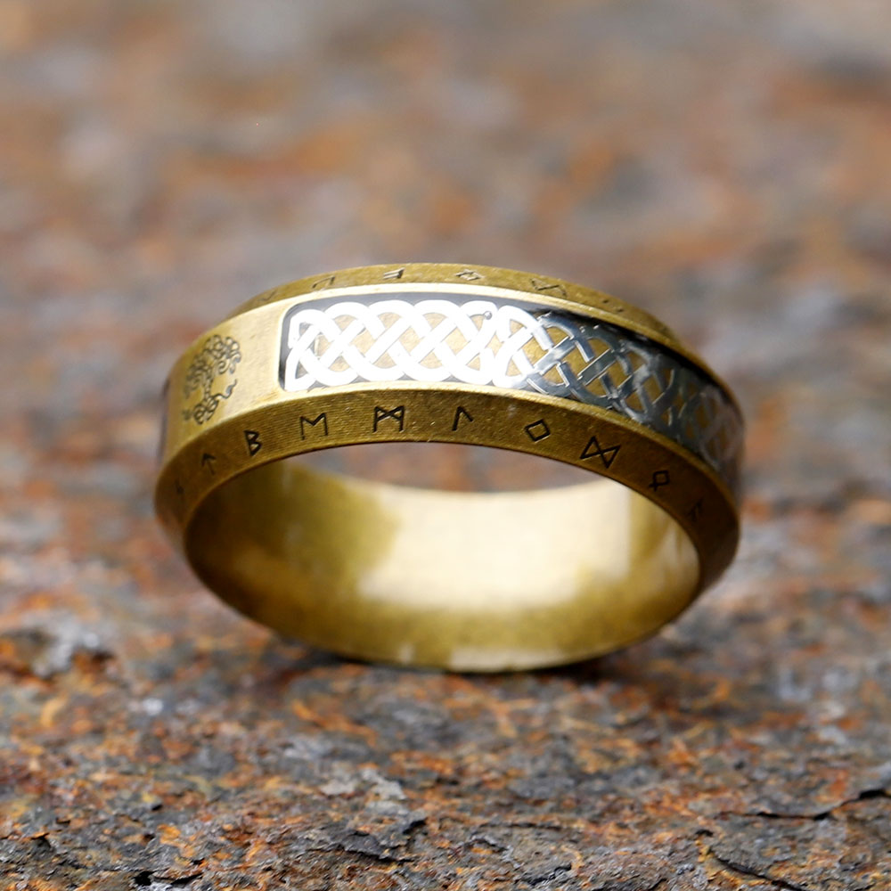 Close-up on the lower side of the ring, showcasing the intricate Celtic knot pattern and adjacent runes.