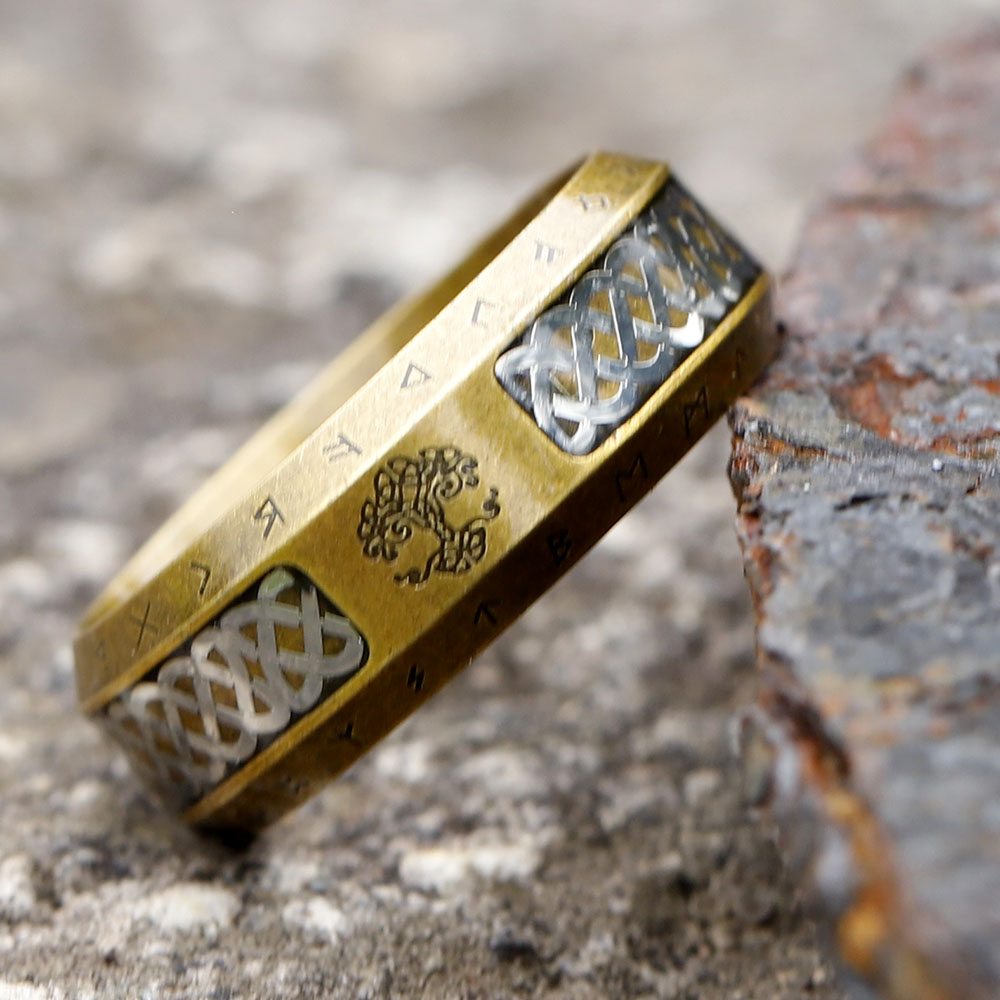 Side profile of the ancient-style stainless steel ring, revealing its distressed finish and runic inscriptions.