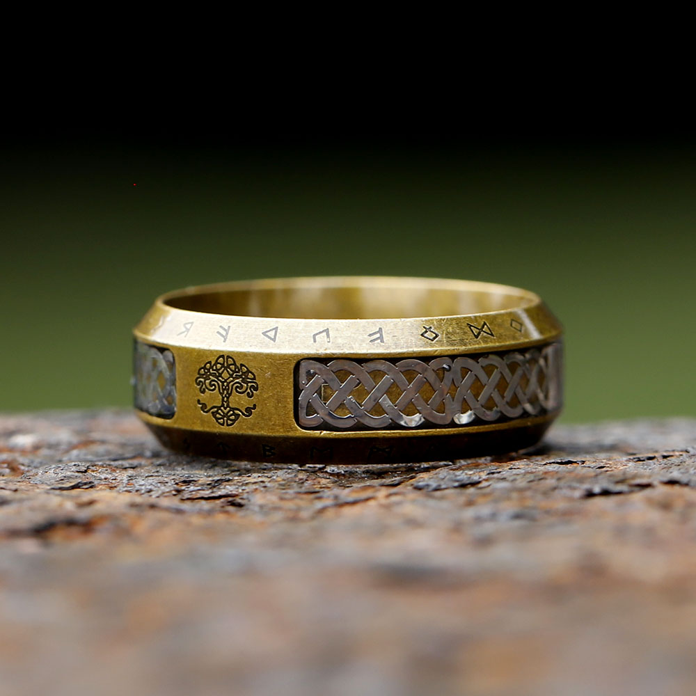 Detail shot of the textured ring band, emphasizing the Futhark runes etched into the metal.